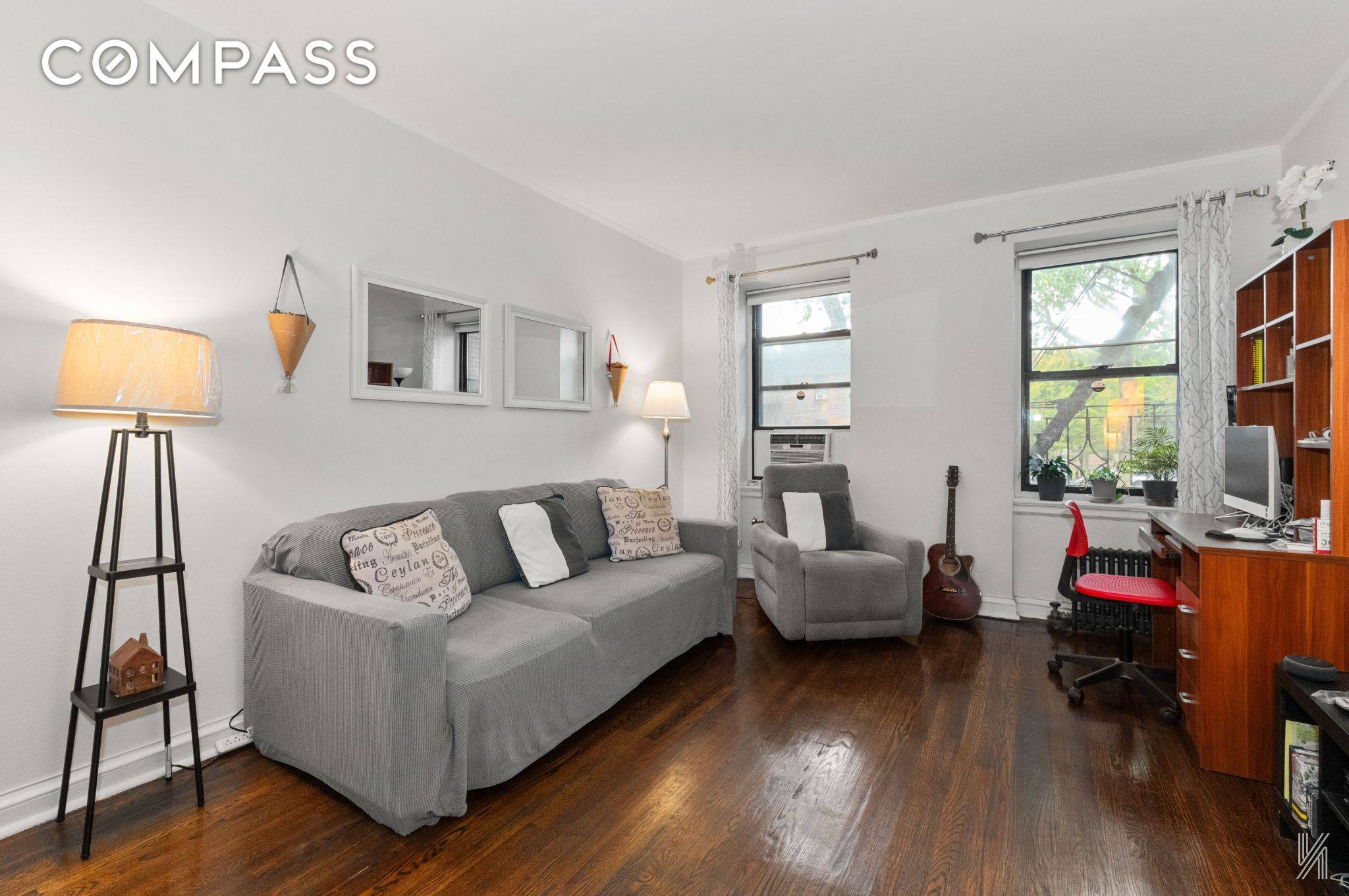 Located in Astoria Heights, this impressive second floor unit features clean white walls and subtly arched entryways.