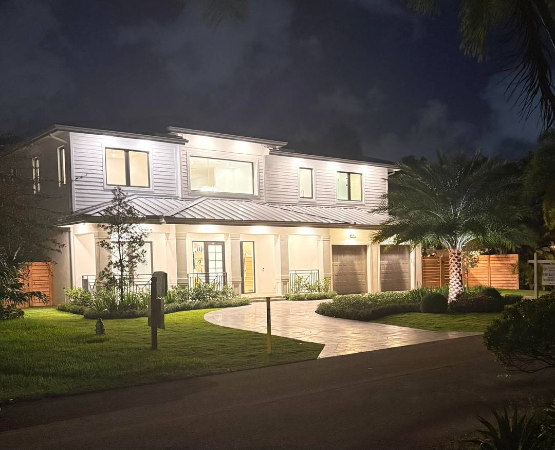 Stunning Modern Key West new construction showcasing a dramatic foyer with sweeping staircase, 23' ceilings welcoming you to the expansive living room with 23' ceilings and an entire wall of ...