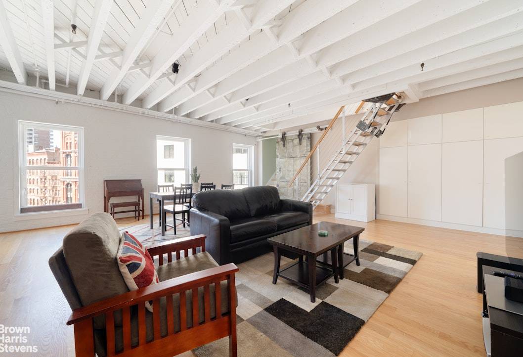 This meticulously renovated Tribeca loft seamlessly blends the iconic character of the neighborhood with contemporary luxury living.