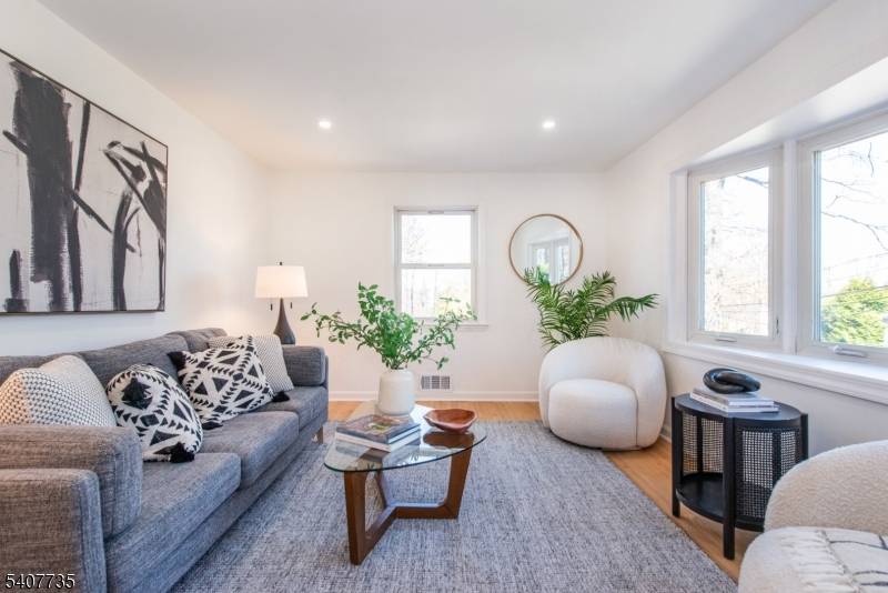 CHARMING, RENOVATED FOUR BEDROOM, THREE FULL BATH CAPE BLENDS CLASSIC STYLE WITH MODERN CONVENIENCE.