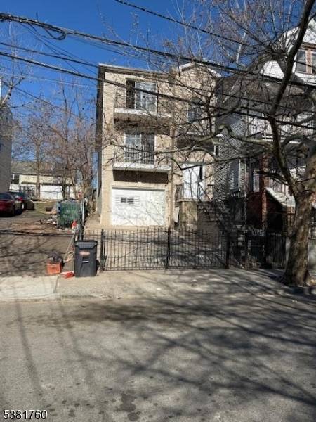 Newer 2 family home built in 2005, features a total of 8 bedrooms and 5 bathrooms, each with separate utilities for added convenience.