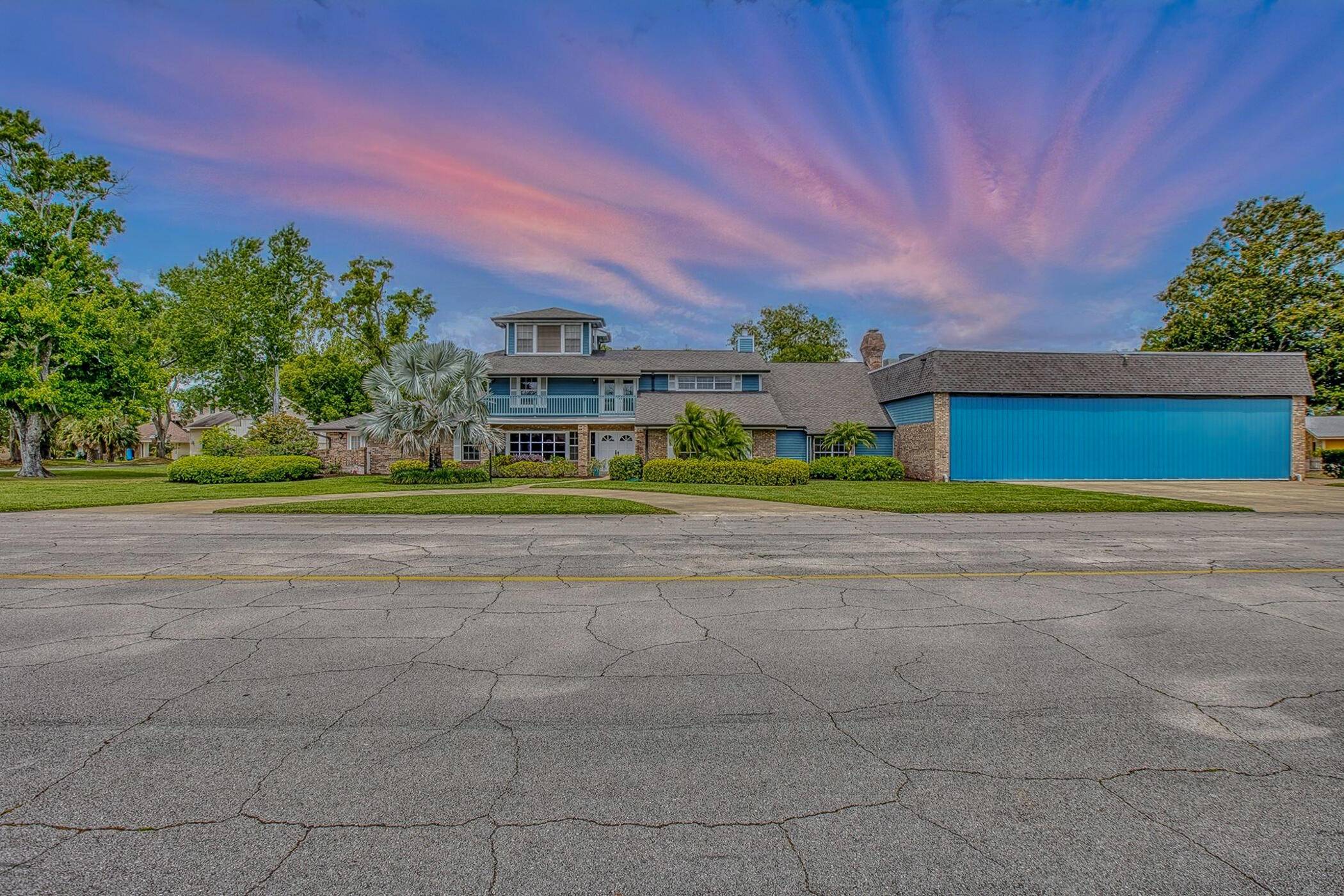 Aviation luxury meets refined living in this exquisite custom hangar estate, gracefully situated on two expansive lots along the main taxiway in the prestigious gated community of Spruce Creek Fly ...