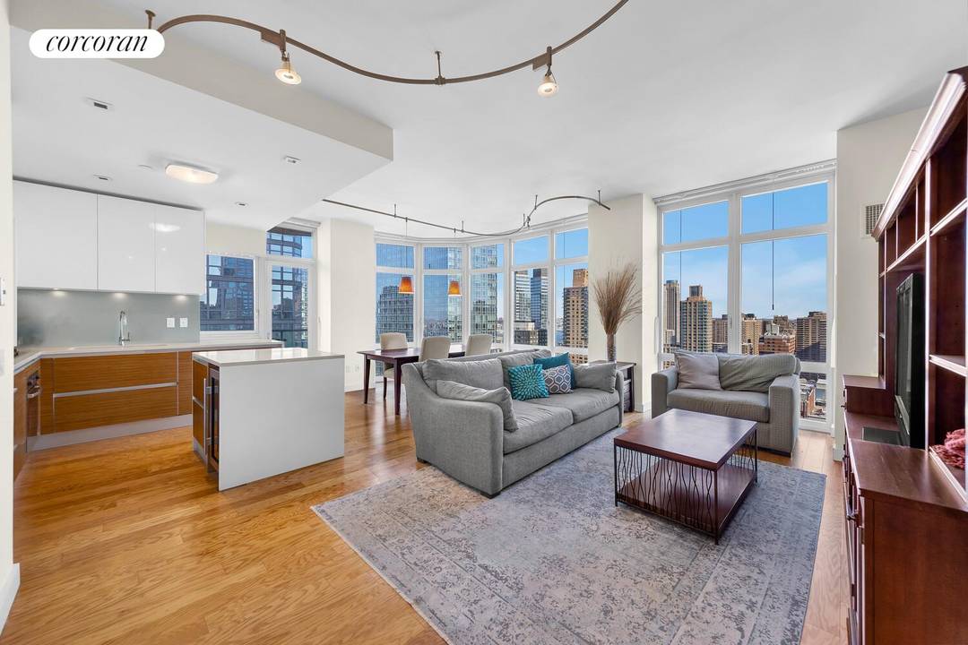 Spacious three bedroom atop the city with north and west exposures and open views.
