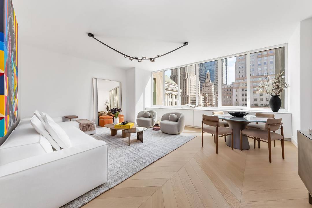 This outstanding two bedroom, two bathroom residence offers exceptional natural light from expansive east facing windows across a luxuriously broad living space, ideally suited for entertaining.