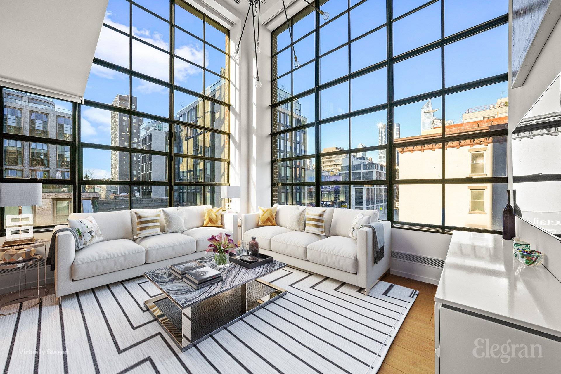 The distinctive charm of this corner duplex begins with its impressive 20ft double height ceilings.