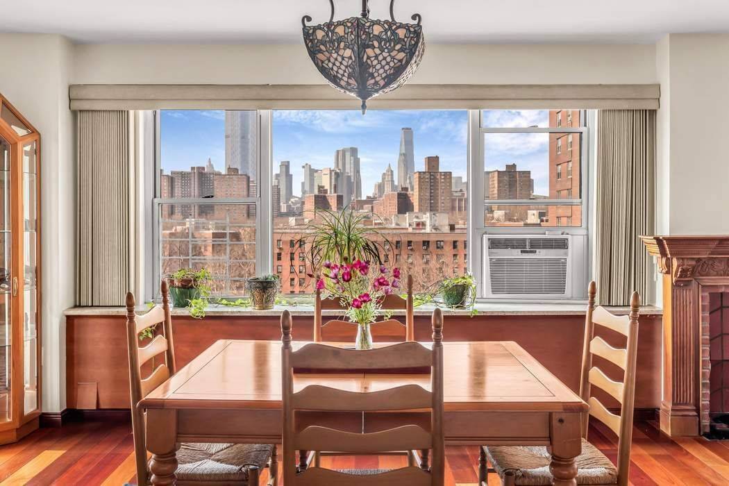Rare four bedroom, two bath Lower East Side home with two private balconies and panoramic views of downtown New York City, the Brooklyn skyline, and the East River.
