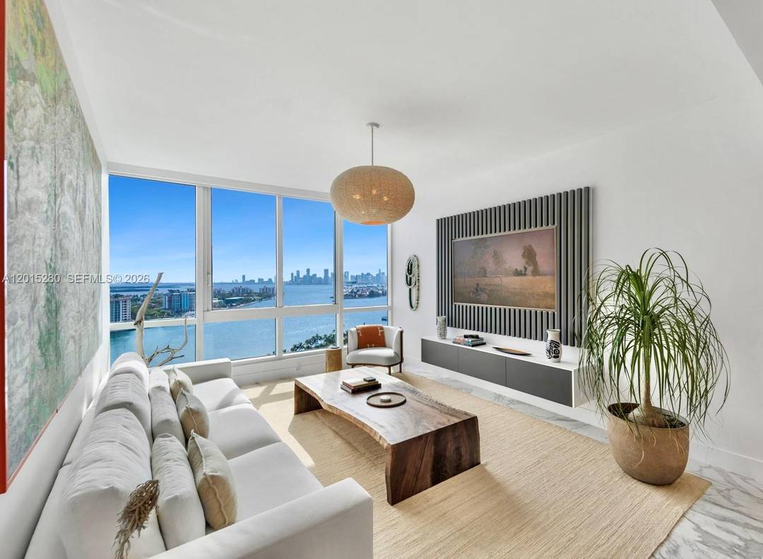 Introducing this refined Continuum residence with panoramic views stretching from ocean to bay.