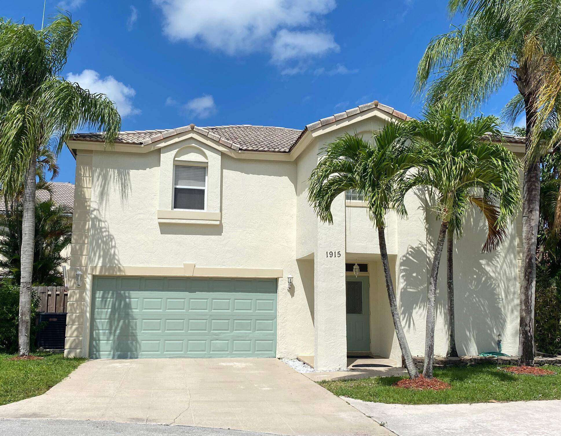 This two story beauty is located in desirable Wellington Lakes community, close to schools, shopping and all equestrian venues.
