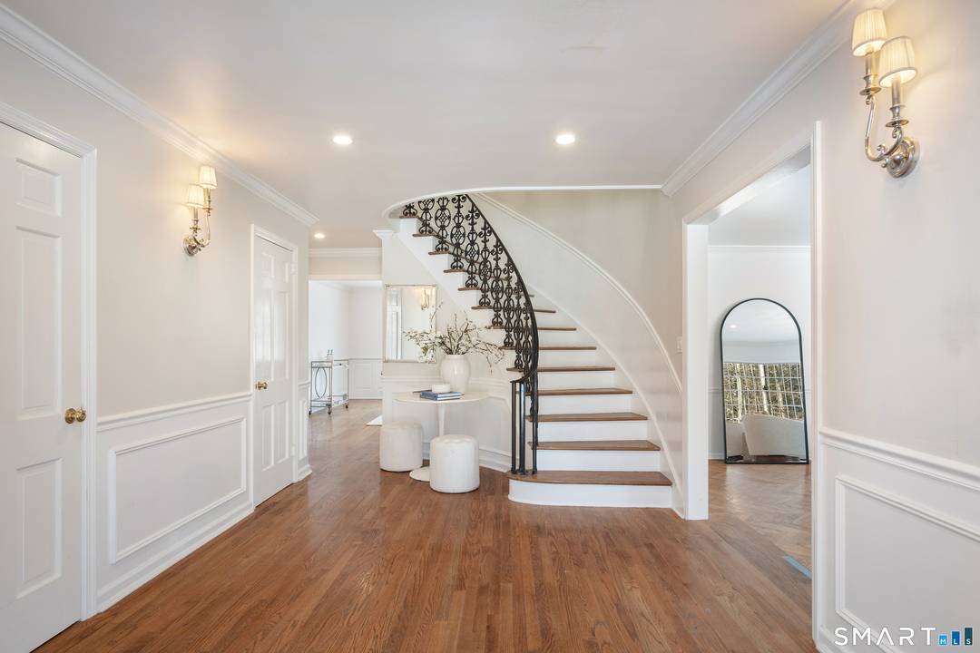 Set 250 feet back on a prime 2 acre cul de sac, this 4, 634 sq ft custom Colonial defines estate style luxury.