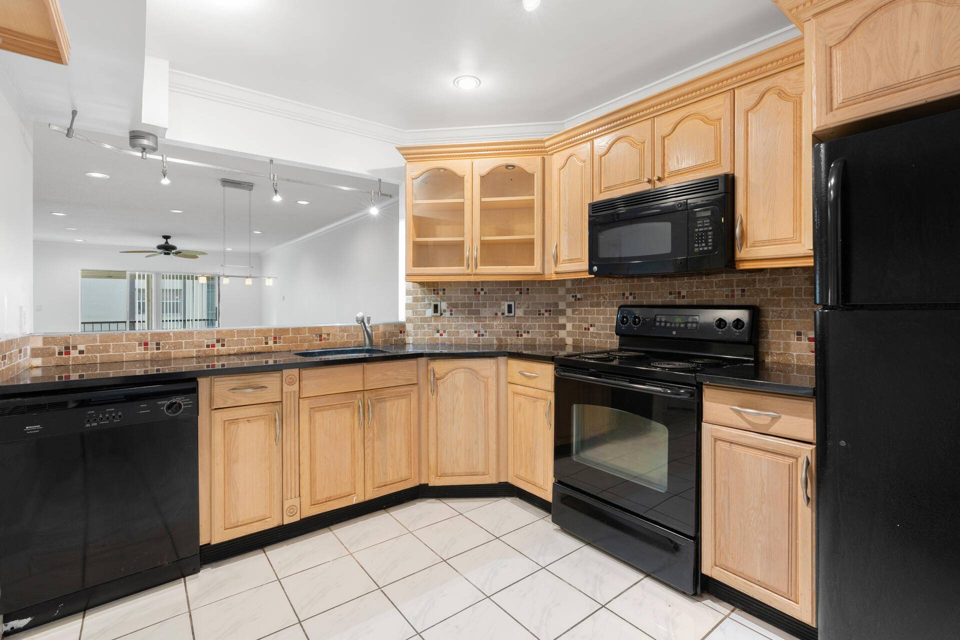 Spacious Bright 2 2 Corner Unit featuring tile and laminated flooring, open dining living area, and a master suite with two walk in closets.