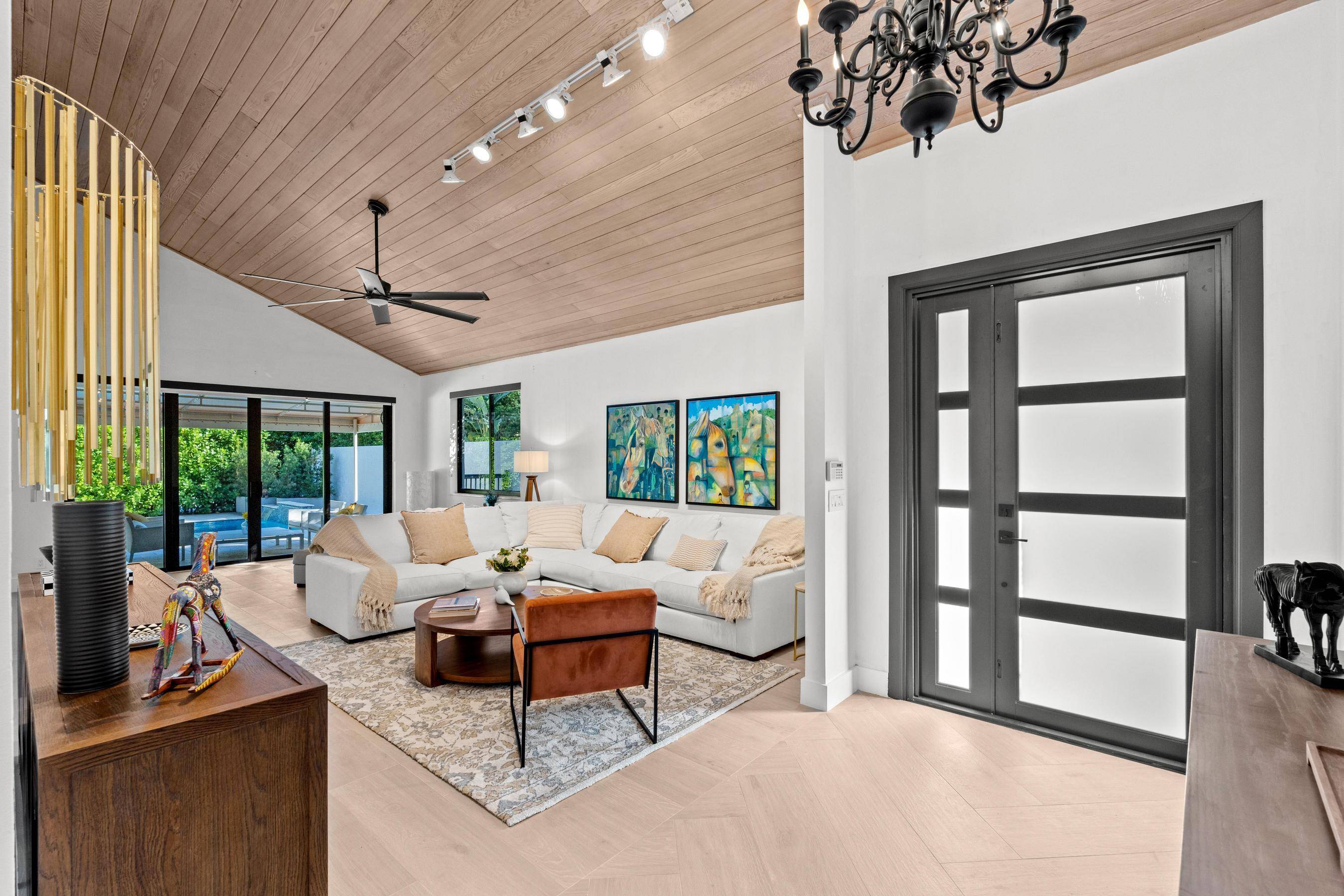 Welcome to a residence that embodies modern tranquility and sleek sophistication, located in the highly desirable Palm Beach Polo community.