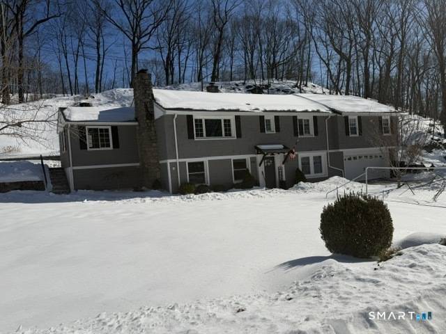 Welcome to this stunning 5 bedroom raised ranch in Orange, Connecticut !