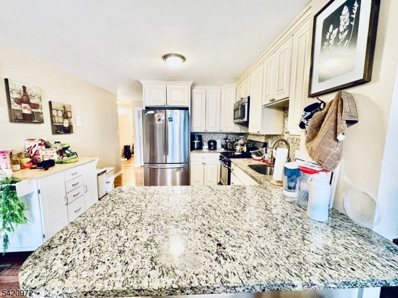 Don't miss this beautiful, recently renovated 4 story townhome featuring private parking, hardwood floors, and two zoned central A C to name a few !