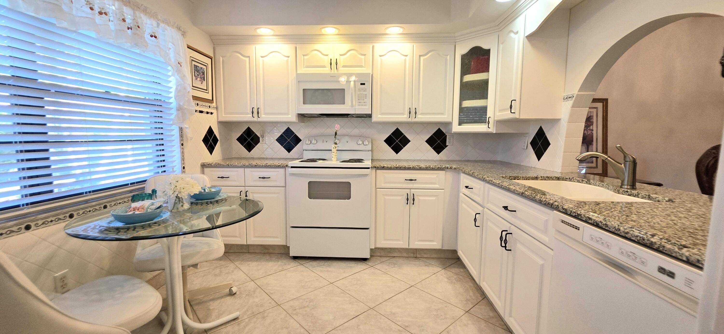 Welcome home to this beautifully maintained 2 2 Villa with a large screened oversized garden patio located in the hidden gem of the desirable 55 Lakes of Boca Barwood.