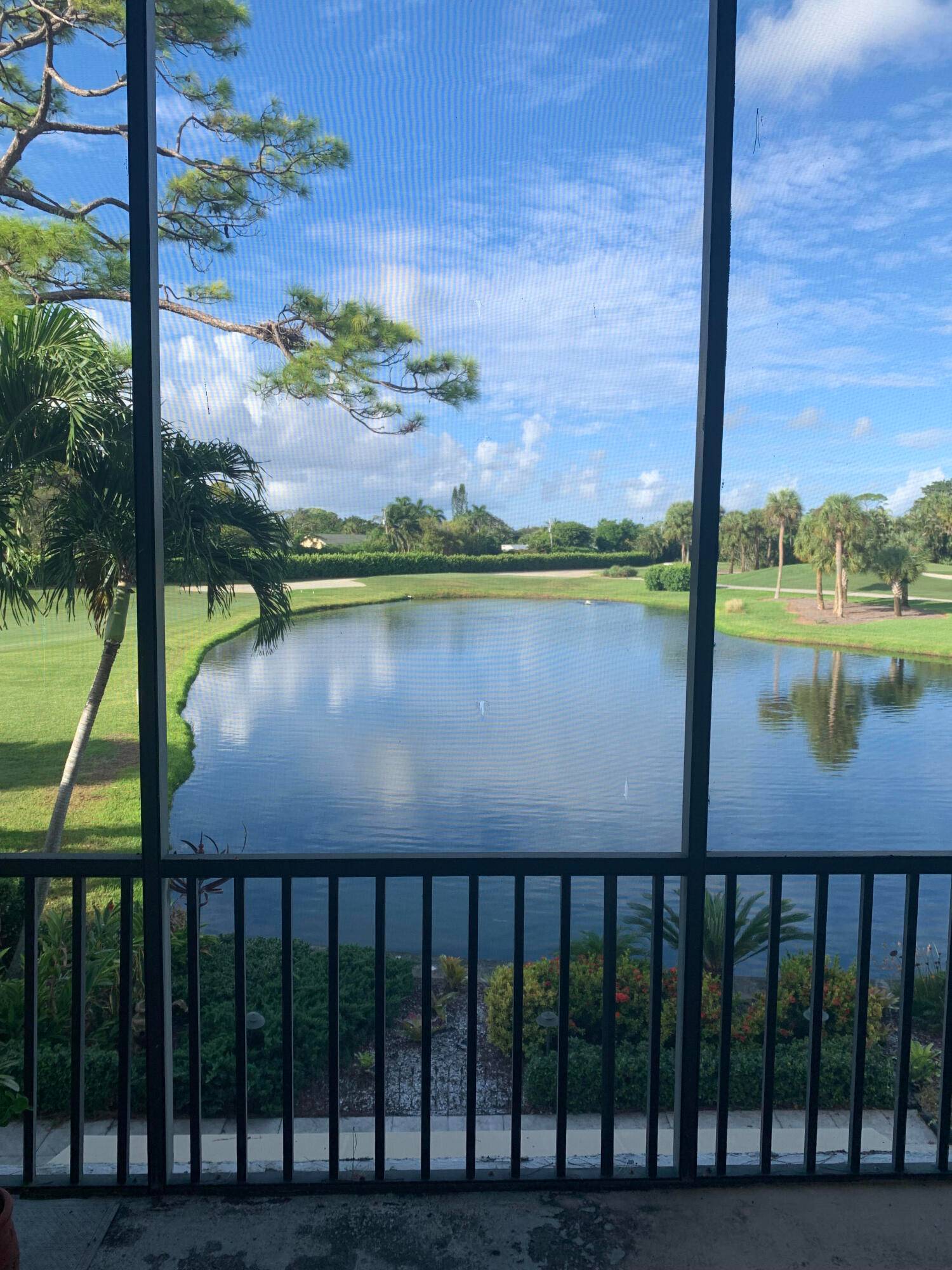 Spacious two story in the picturesque Seagate Country Club All ages Serene views of lake and course from living and dining area and the master bedroom.