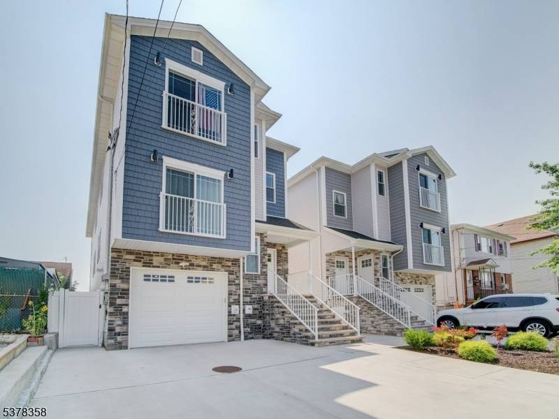 Built in 2023 and still eligible for a 5 year tax abatement, this stunning two family home is one of the finest in North Elizabeth.