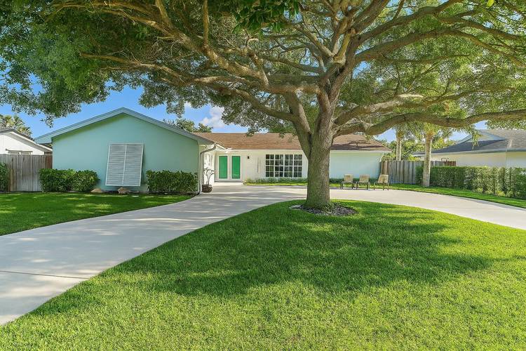 Completely renovated top to bottom with beautiful high end finishes POOL home located within the heart of Palm Beach Gardens with NO HOA !