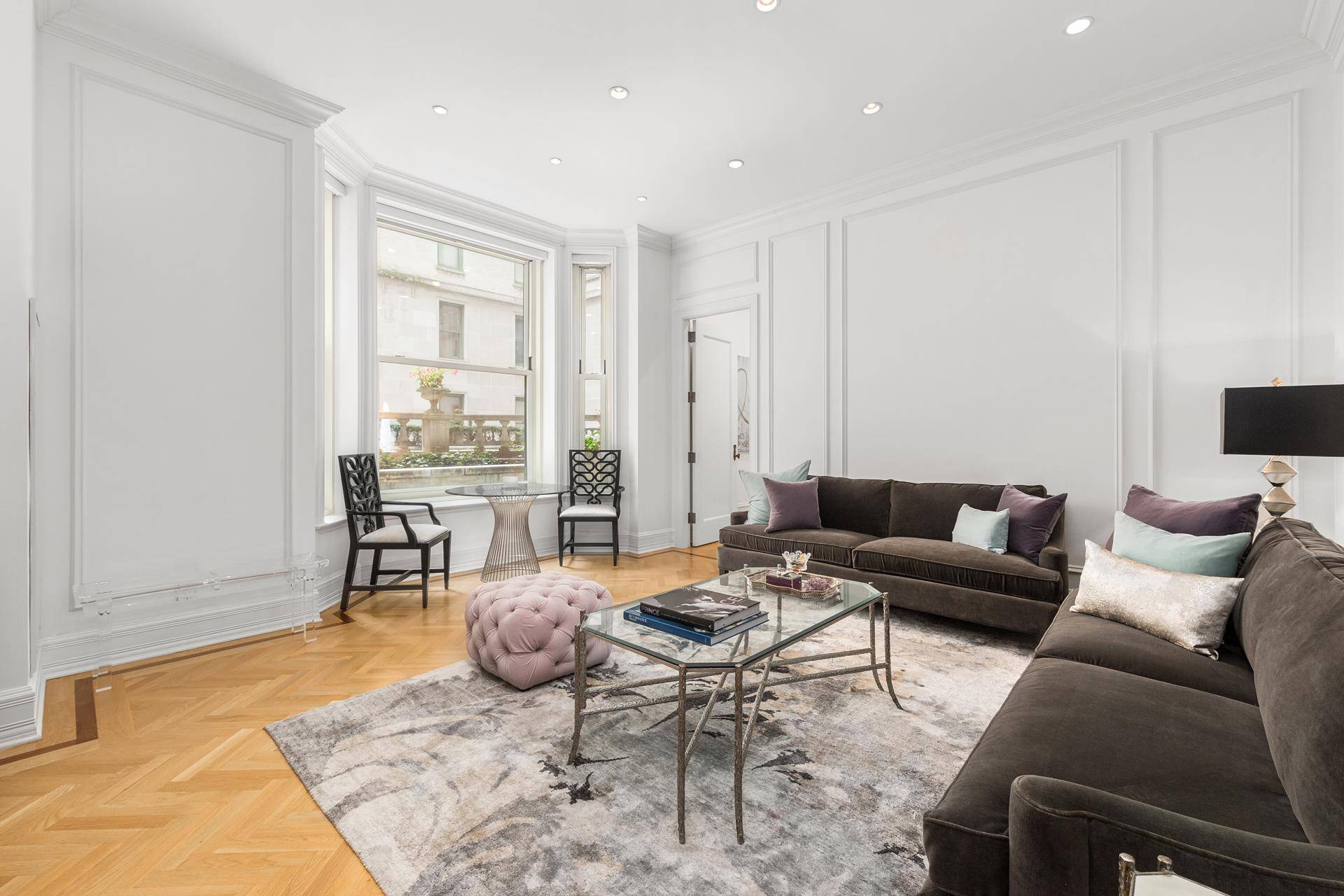 Own at the iconic Plaza an expansive residence featuring 11 ft.