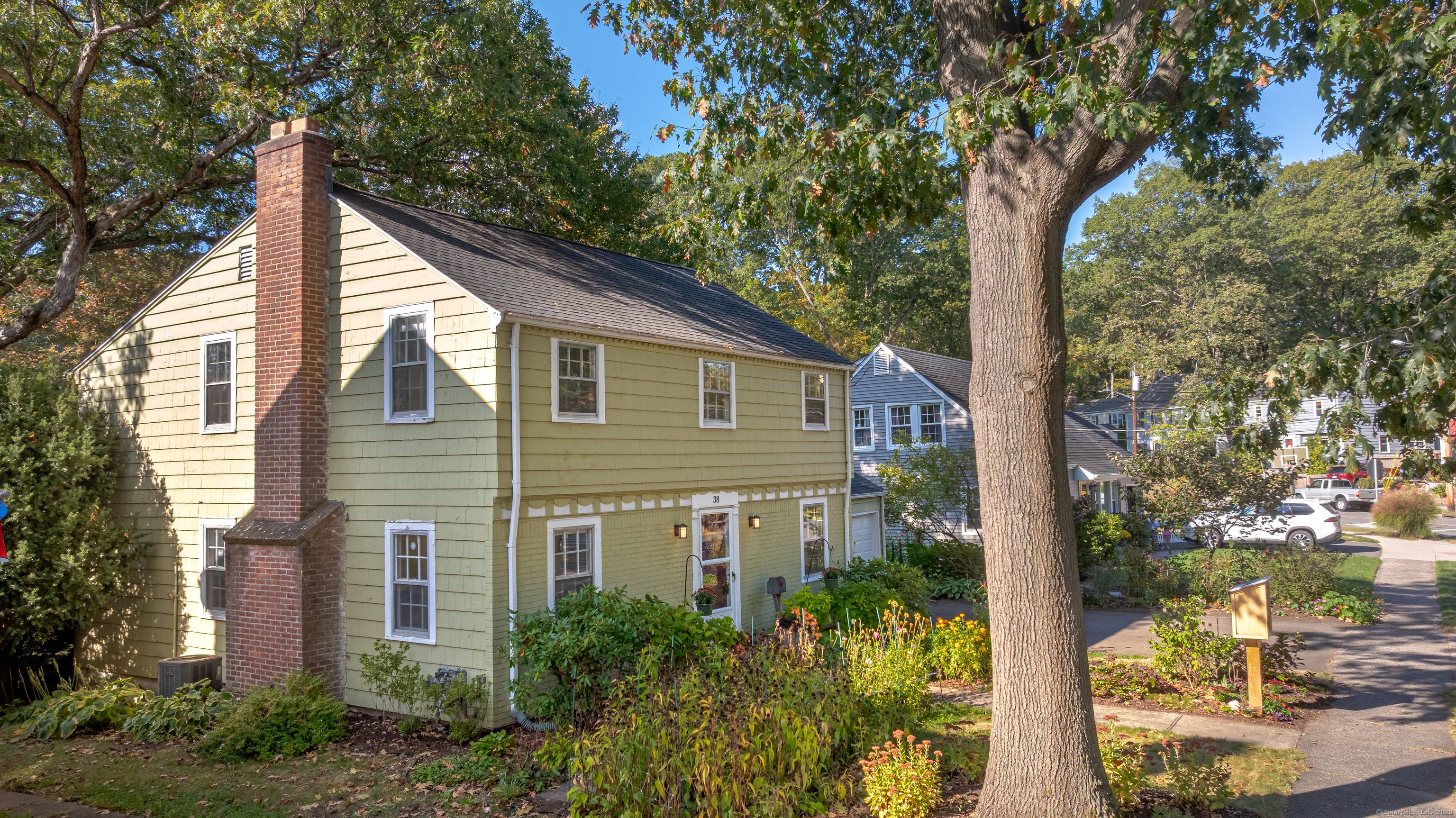 Classic, charming Spring Glen Colonial with warm inviting formal living room with wood burning fireplace, leading to south facing sun room with built ins.