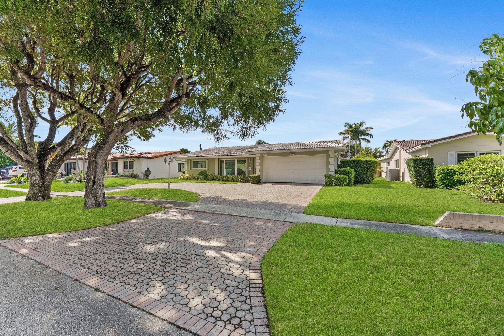 Discover this exceptional 6 bedroom, 4 bath residence with a den and spacious 2 car garage, complete with a wall A C unit for flexible comfort.