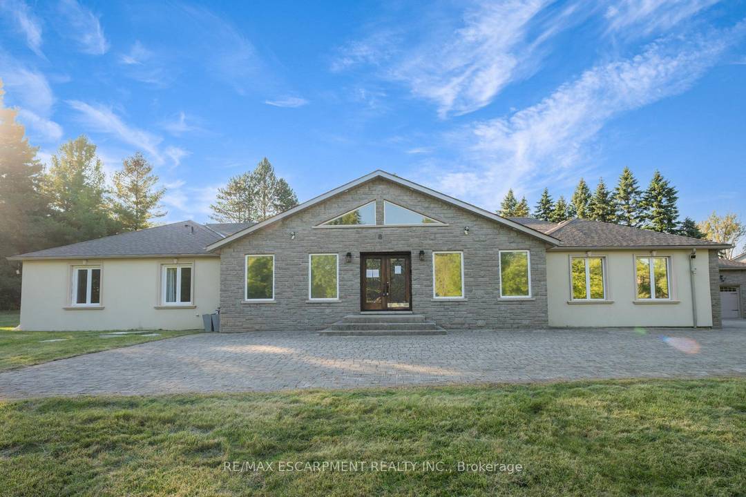 Modern, spacious, and bright 5 1 bedroom, 7 bathroom bungalow nestled on a scenic and private lot.