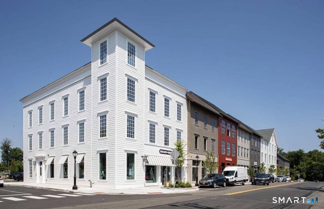 Step into this luxury corner unit that offers refined elegance, modern design, and privacy all in the heart of downtown Darien's premier neighborhood, The Corbin District.