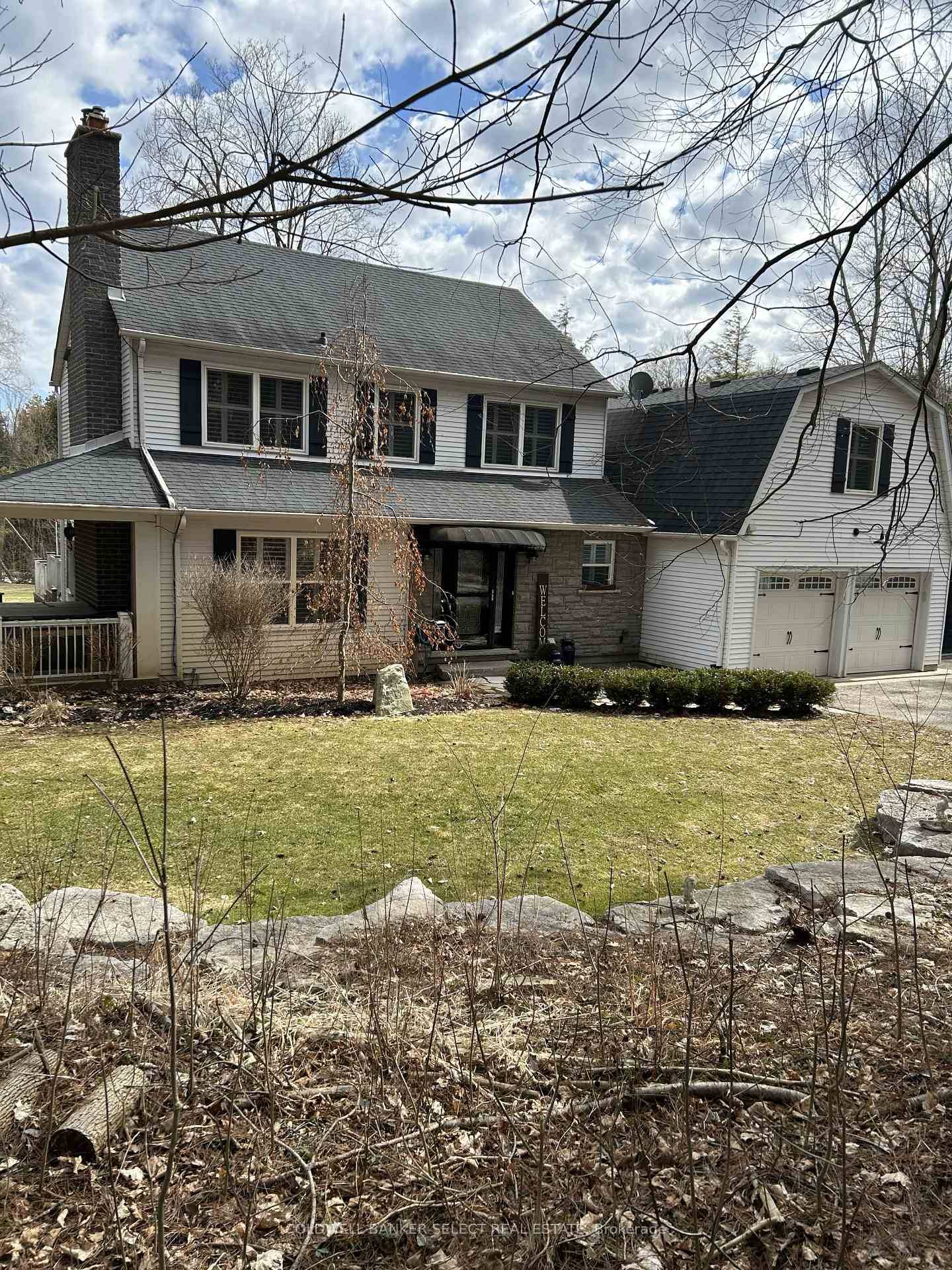 Secluded, tranquil 5 acre rolling property with running stream.