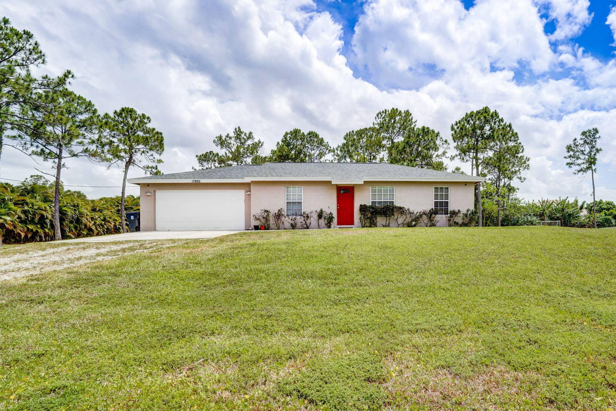 Ready to call this charming property in the Acreage HOME ?