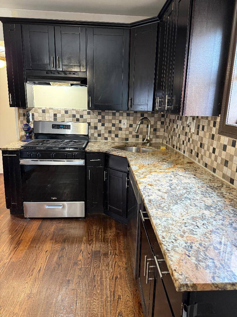 Three bedroom apartment with beautiful hardwood floors throughout.
