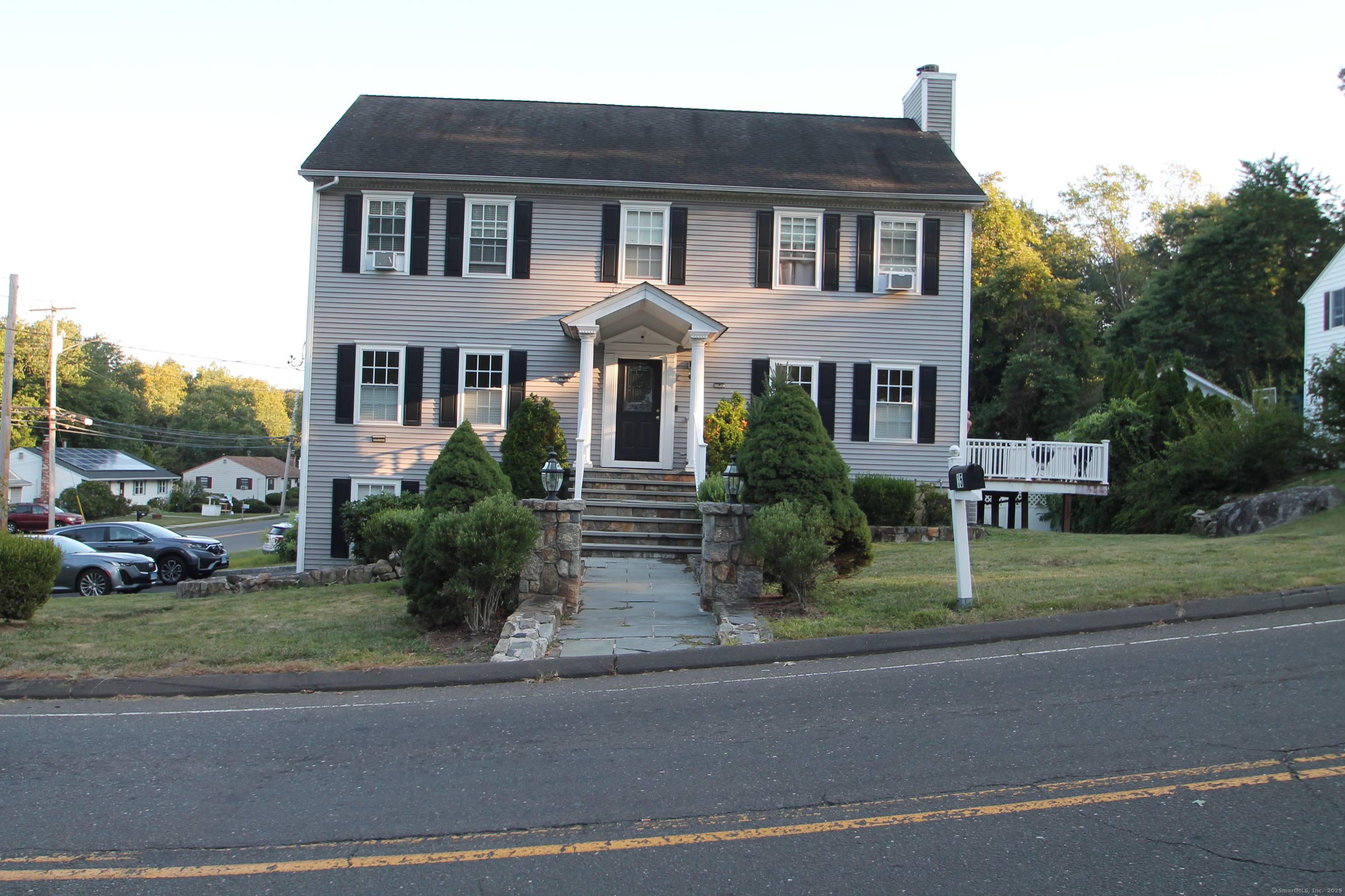 Colonial style home with possible In Law featuring 11 Rooms 4 5 Bedrooms 3 full Bathrooms.