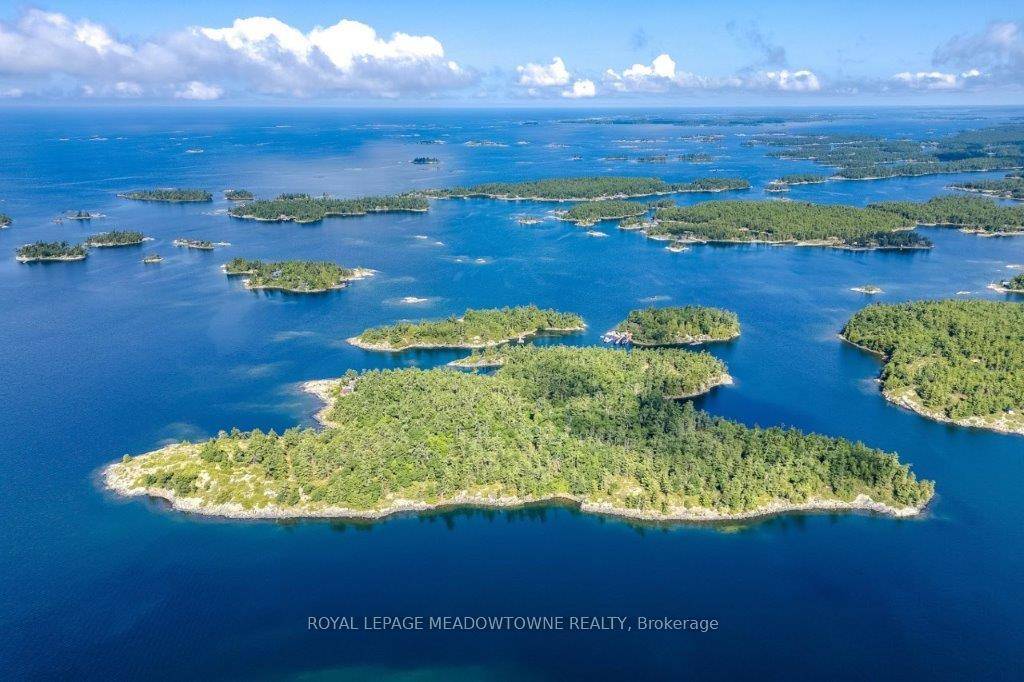 CAMPBELL ISLAND A LEGACY PROPERTY 25 acre island located in north Sans Souci, Campbell Island is divided into 5 legally severed 5 acre lots plus right of way.