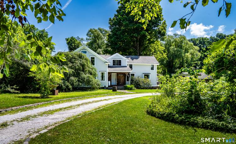 Experience the charm of country living in this beautifully renovated 5 bedroom farmhouse, nestled in one of Connecticut's most beloved small towns.