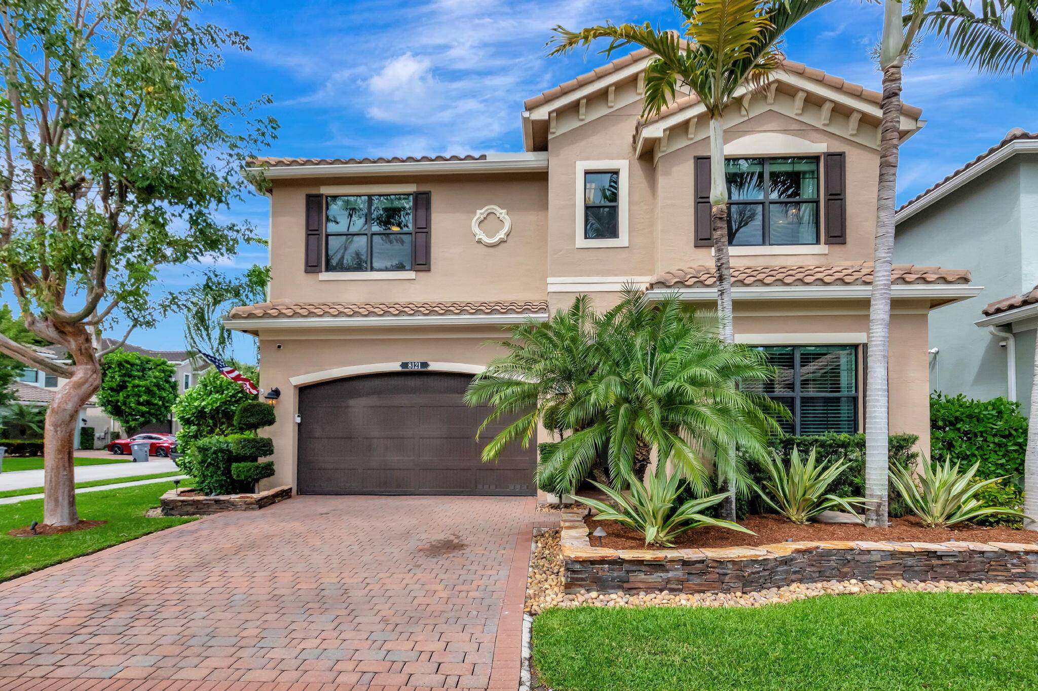 This elegant 4 bedroom, 3 bathroom home features a spacious open concept layout with family, dining, and kitchen areas.