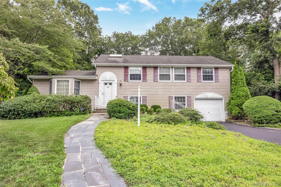 Welcome to this spacious 4 bedroom, 2 full bathroom Splanch home offering comfort, charm and convenience.