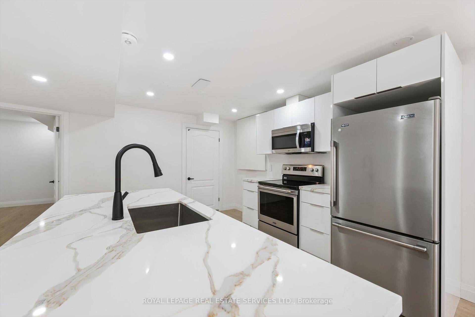 This brand new legal, modern apartment offers a stylish kitchen complete with quartz countertop island, stainless steel appliances and a convenient pantry for extra storage.