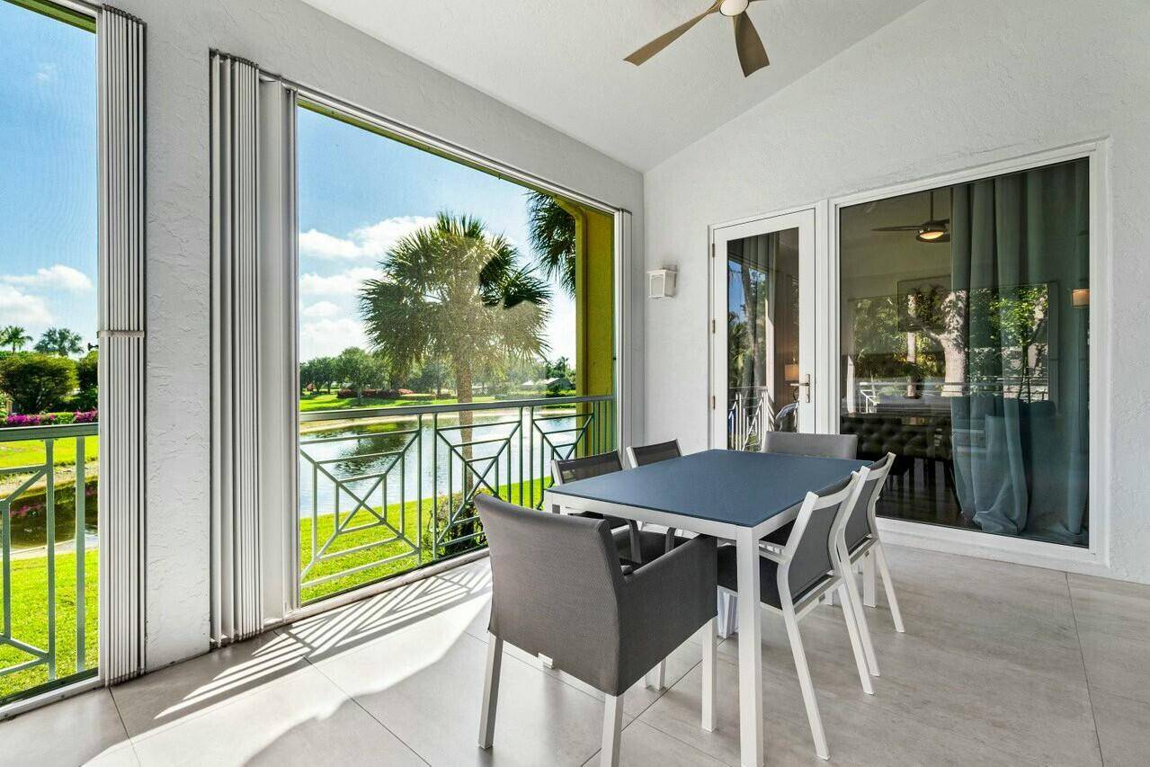Stunning and completely renovated, second floor corner condo in The Palms community of Ballenisles.