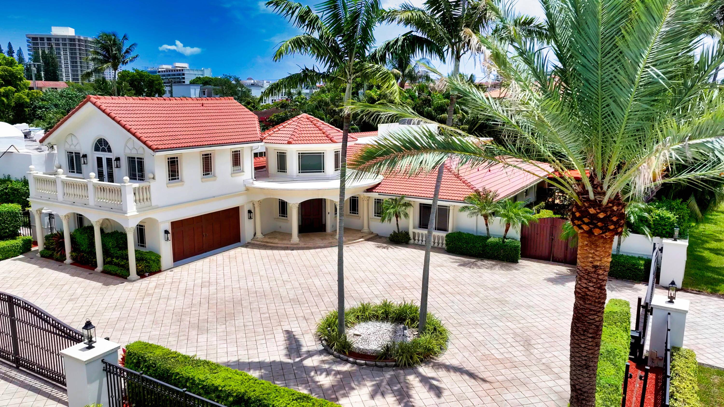 Ensconced on a desirable corner lot in one of the most exclusive beachside enclaves in Boca Raton, the property is walled, hedged and gated for privacy.