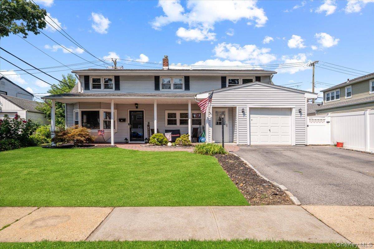 Welcome to this beautiful turn key expanded cape home in Levittown !