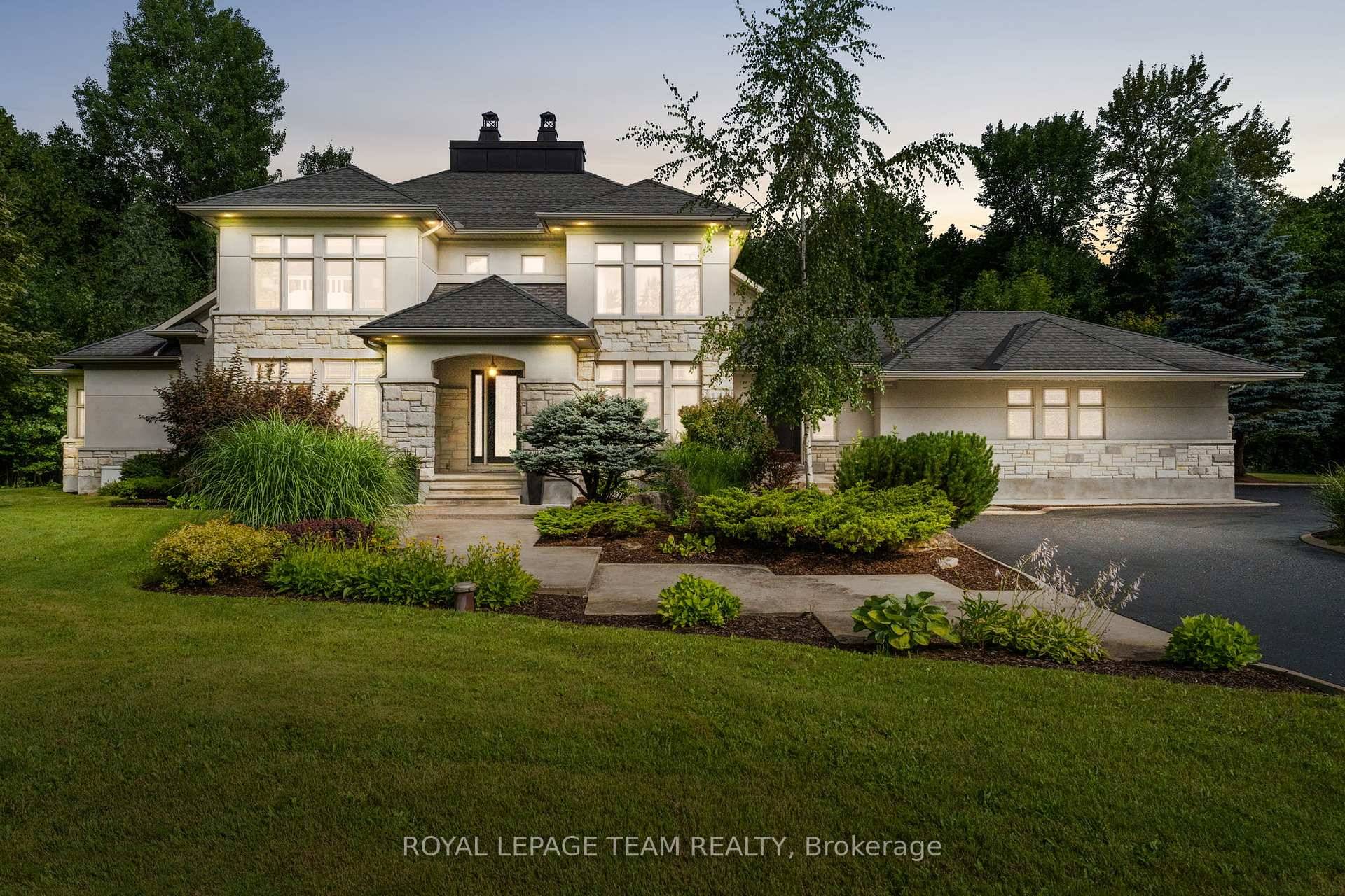 Nestled in the South Point community of Manotick, this beautifully designed family home is set on an approximately 1.