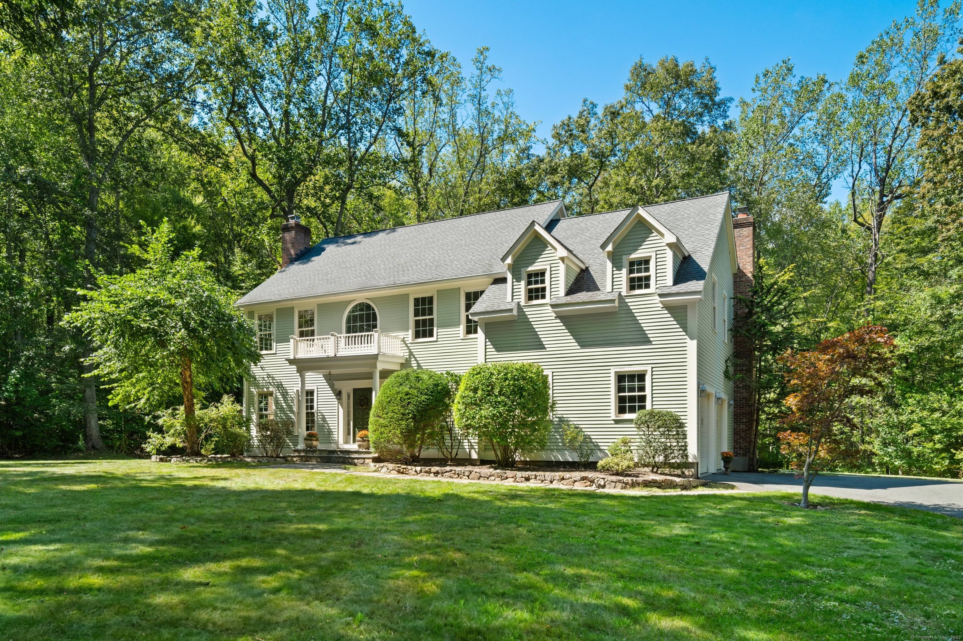 Designed for everyday comfort, this 4 bedroom Colonial combines the privacy of a wooded retreat with the convenience of nearby schools, dining, shopping, and NYC commute.