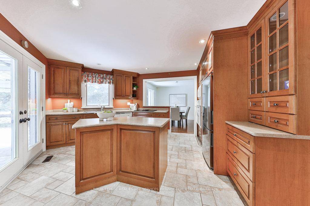 Enjoy the privacy amp ; tranquility surrounded by mature trees with a fenced yard in this traditional 4 1 bedroom family home.
