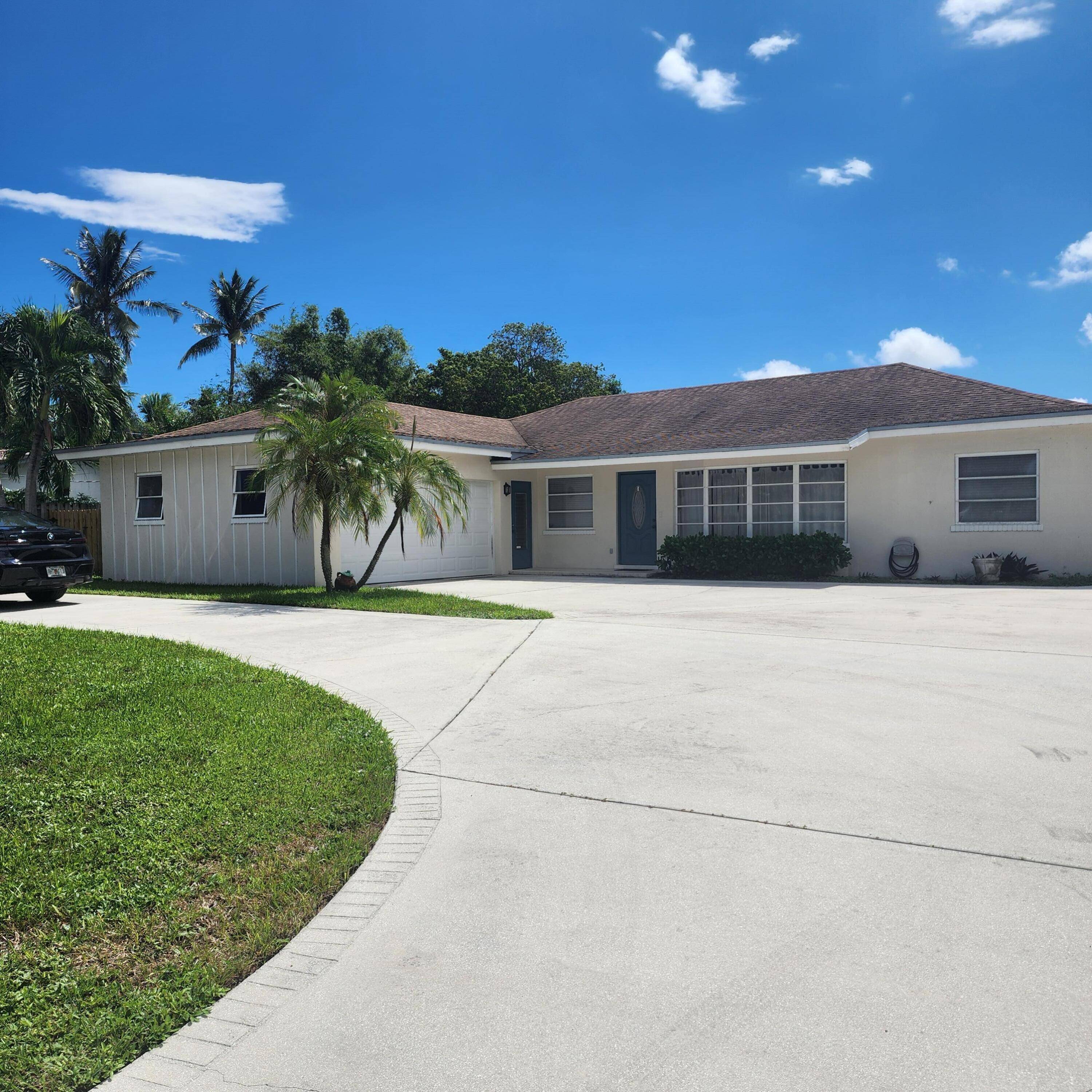 Nestled on a beautiful property featuring stunning views of the pool, waterways and boat dock.
