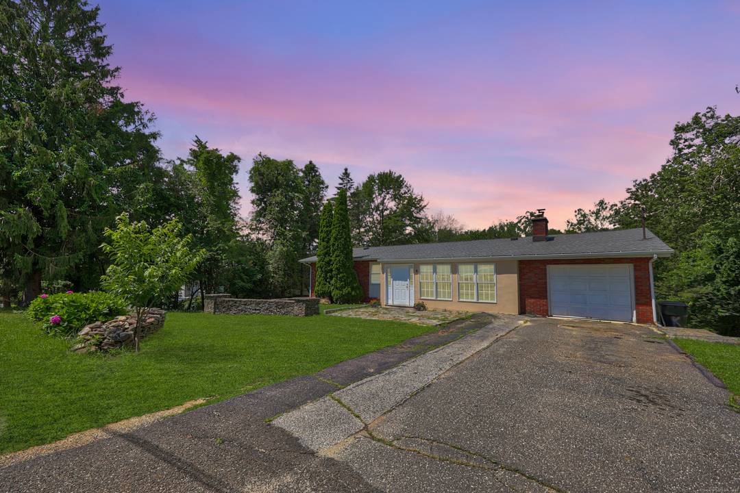 Welcome to 9 Corrine Drive, a spacious and versatile home nestled in the desirable town of Prospect, CT.