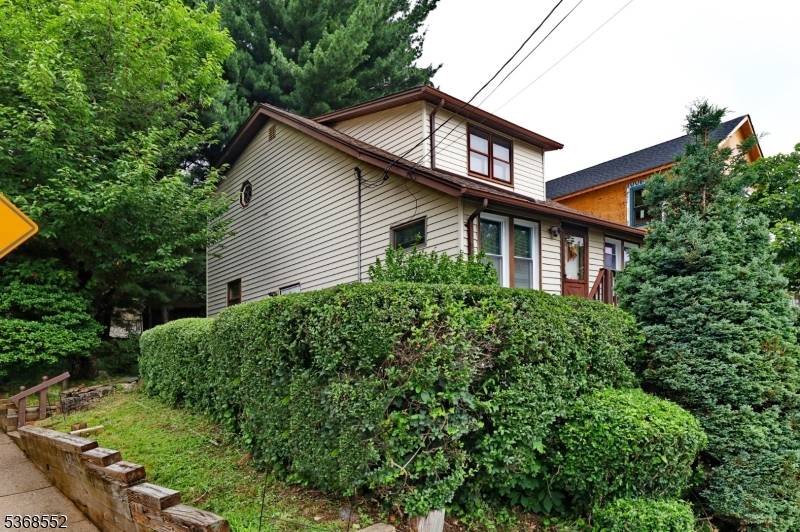 This corner lot is situated in Garret Mountain, offering breathtaking views of the New York City skyline.