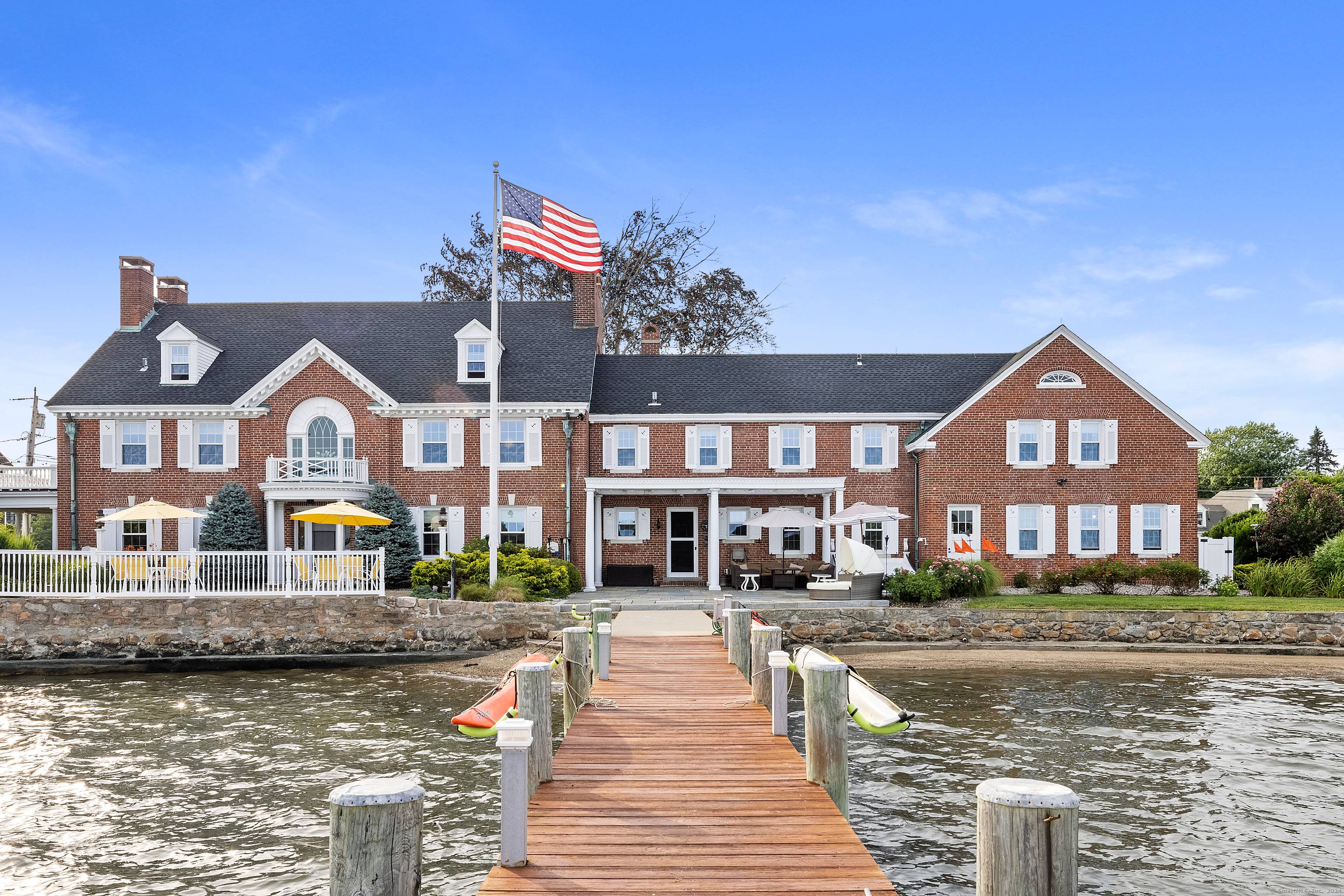 Discover The Oldfields Estate a rare masterpiece of coastal elegance nestled on the western banks of the Mystic River.