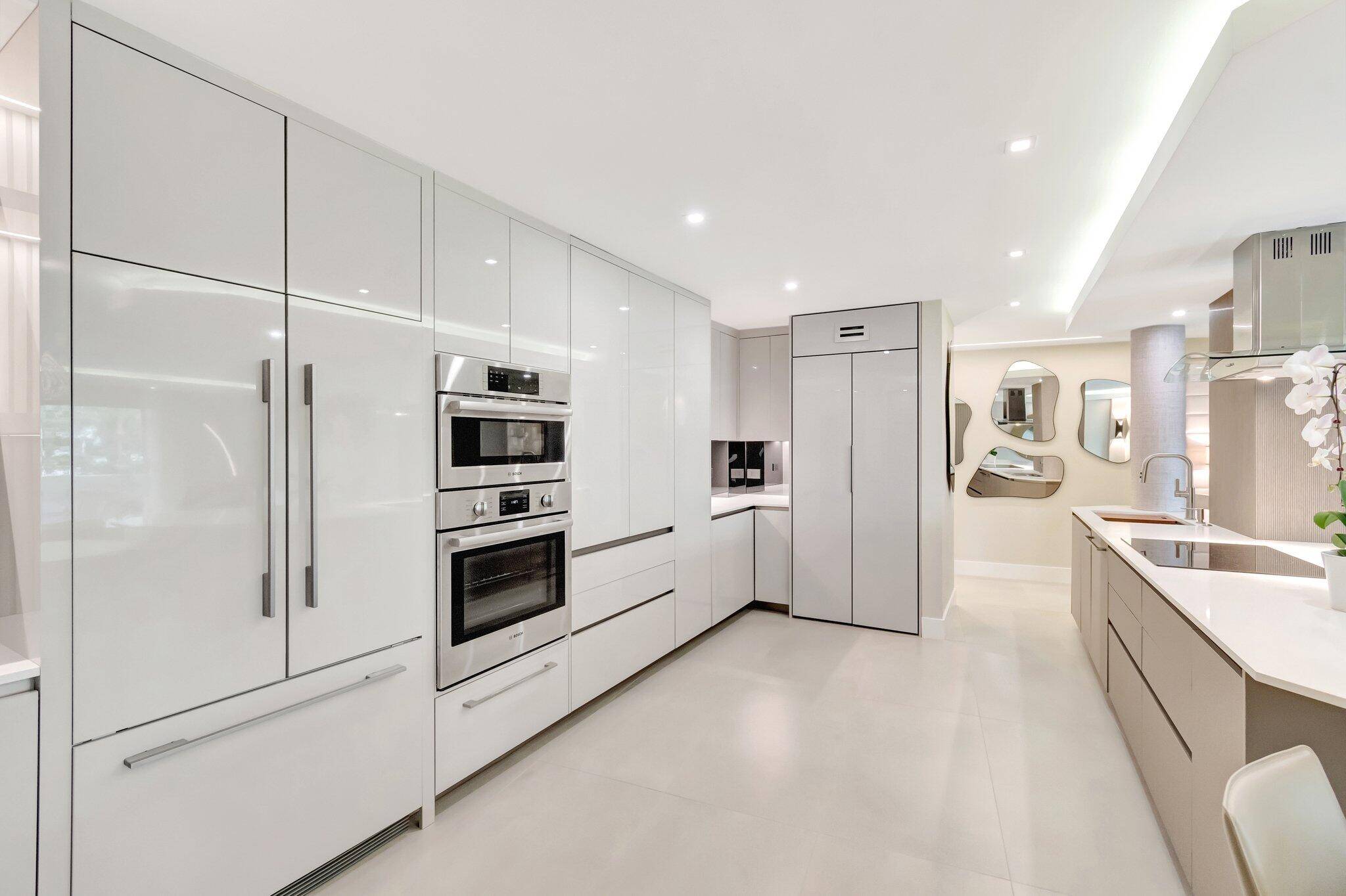 NEUTRAL AND SERENE Unparalleled sophistication and luxurious living overlooking the Prestigious 'LAKE BOCA' Totally renovated 2 bedroom 2 bathroom GORGEOUS condo Sleek and modern kitchen with custom Italian cabinetry, BOSCH ...