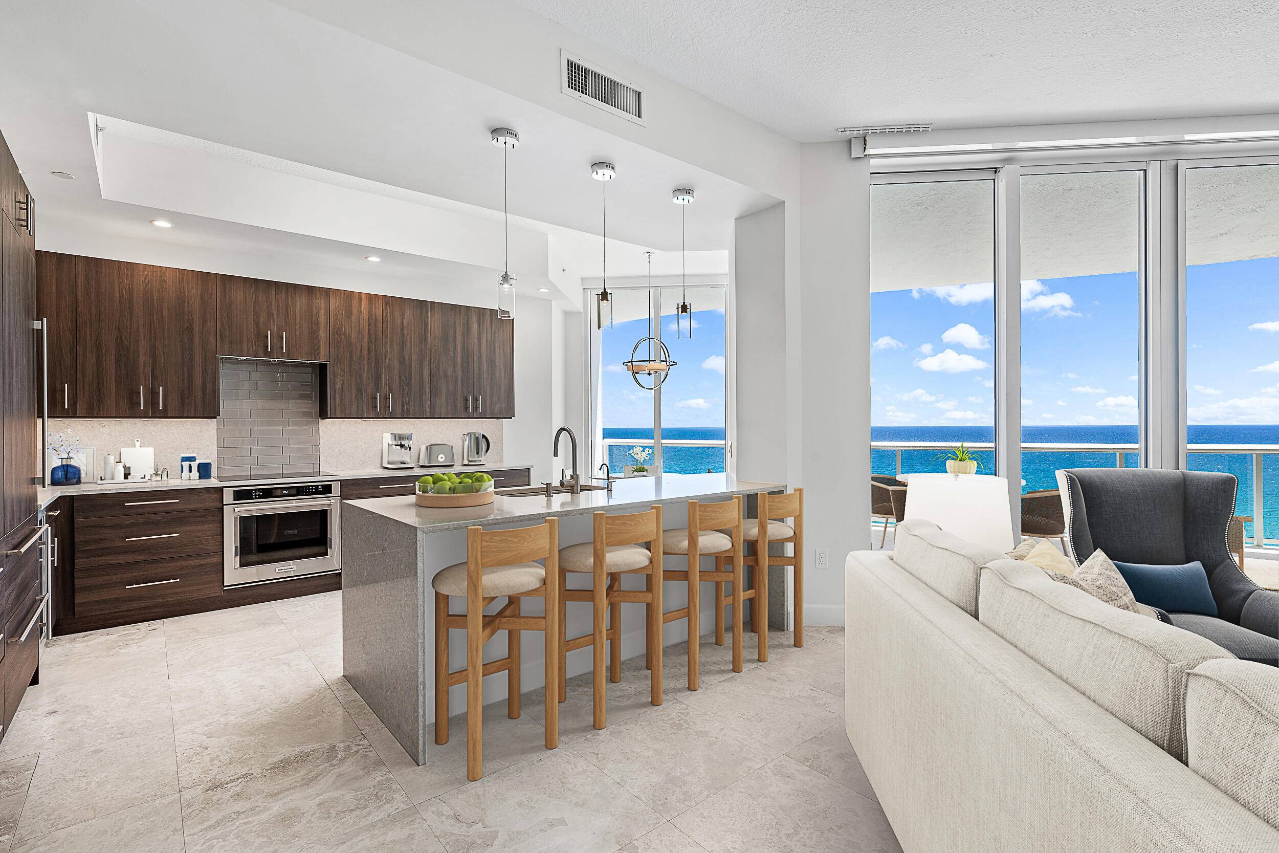 Renovated 3 bedroom, 3 bath condo with panoramic views of ocean and Intracoastal with floor to ceiling glass.