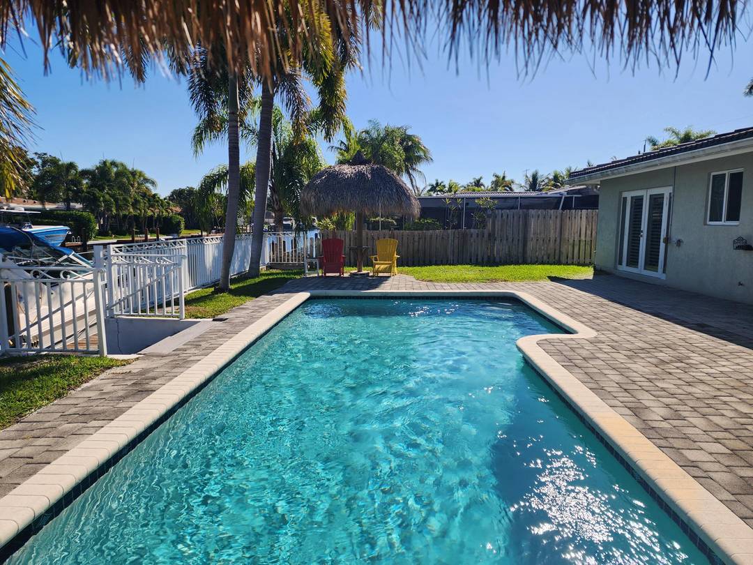 Enjoy direct waterfront living in this beautifully maintained 3 bedroom, 2 bath home with pool, located on a quiet street with excellent access through two fixed bridges.