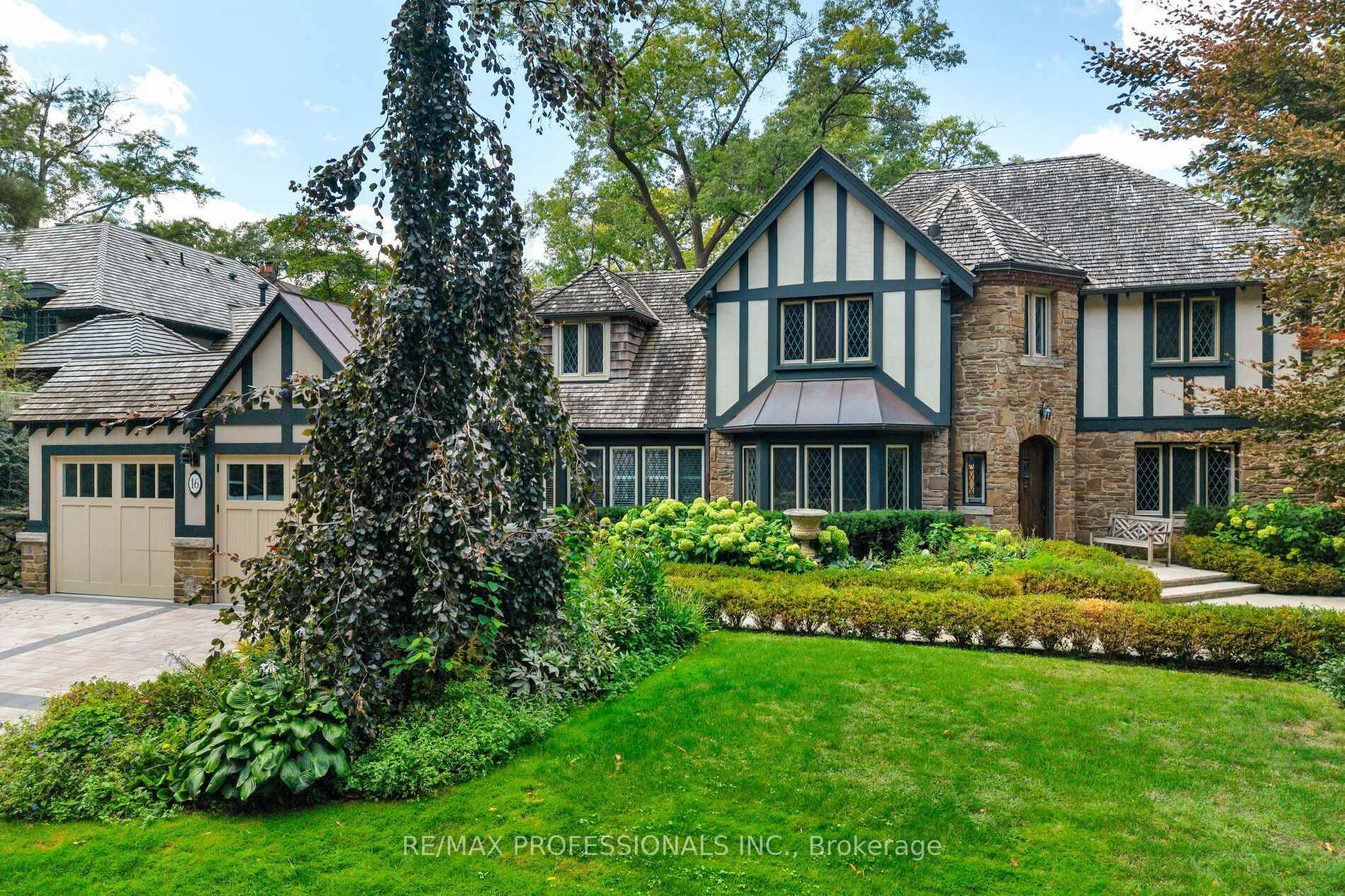 Magnificent R. Home Smith Tudor set on an elevated lot across from the Humber River Valley.