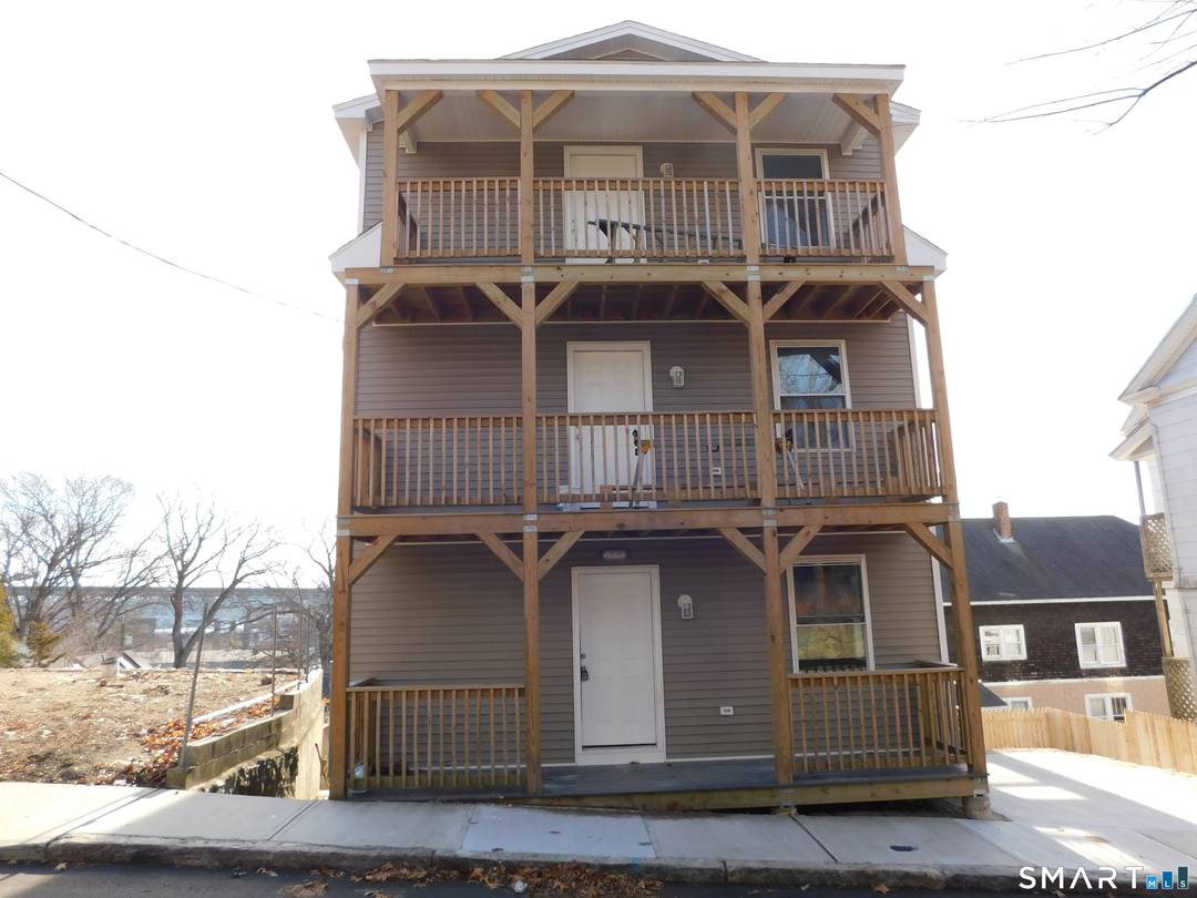 This four family home is completely new from the foundation up.